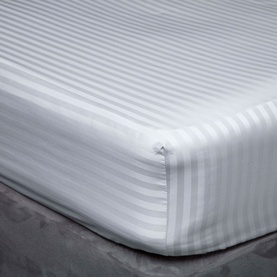 Belledorm Hotel Suite Platinum Fitted Sheet in metallic, 540 thread count sateen cotton, shown fitted on a double bed with subtle stripe texture