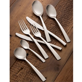 Belleek Eternal 44-Piece Cutlery Set in silver polished stainless steel, showing forks, knives and spoons arranged on a wooden surface
