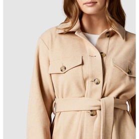 Model wearing Forever New Rosie Belted Shacket in brown, featuring gold buttons, chest pockets, and a self-tie belt