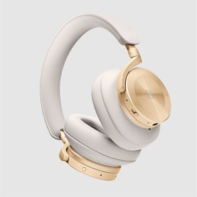 Bang & Olufsen Beoplay H95 over-ear headphones in gold, featuring cushioned ear cups and adjustable headband