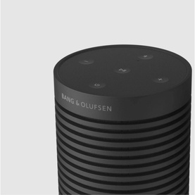 Bang & Olufsen Beosound Explore portable wireless speaker in black, close-up of top controls and ribbed cylindrical body