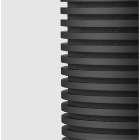 Bang & Olufsen Beosound Explore portable speaker in black, showing close-up of ribbed cylindrical body detail