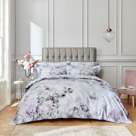 Bianca Amethyst 400 Thread Count Duvet Set in purple floral print, styled on a double bed with matching pillowcases in a grey bedroom