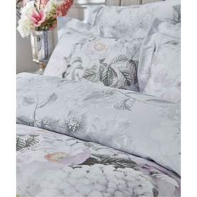 Bianca Amethyst 400 Thread Count Duvet Set in purple with floral botanical print, styled with matching pillowcases on a bed