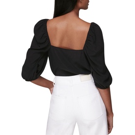 Model wearing Whistles Blanche Square Neck Top in black with puff sleeves and open square back, styled with white wide-leg trousers
