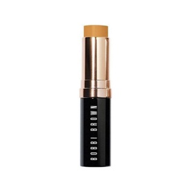 Bobbi Brown Skin Foundation Stick in Golden Honey shade, black cylindrical stick with gold cap