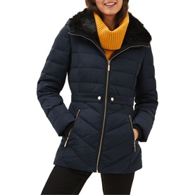Model wearing Phase Eight Bobbie Short Puffer Coat in blue, quilted with detachable faux fur collar, zip fastening, styled with yellow knit