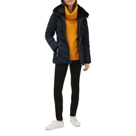 Model wearing Phase Eight Bobbie Short Puffer Coat in blue with detachable faux fur collar, styled with mustard roll-neck and black trousers