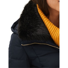 Model wearing Phase Eight Bobbie Short Puffer Coat in blue with detachable black faux fur collar, styled with a mustard roll-neck jumper