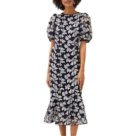 Model wearing Phase Eight Caitlyn Guipre Lace Dress in blue, with white floral lace, short puff sleeves, round neck, and peplum midi hem