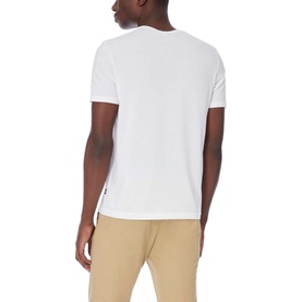 Model wearing Boss Black Casual Tiburt 55 T-Shirt in white, rear view, styled with beige chinos