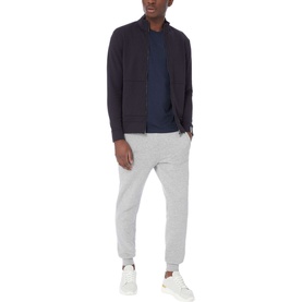 Model wearing Boss Black Casual 55 Tiburt Crew Neck T-Shirt in navy, styled with a navy zip-through jacket and grey joggers