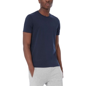 Model wearing Boss Black Casual 55 Tiburt Crew Neck T-Shirt in navy, styled with grey joggers