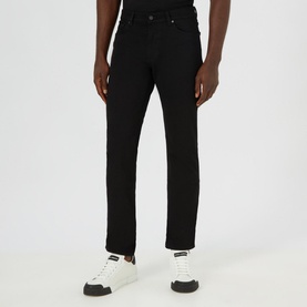 Model wearing Boss Black Casual Maine Mid Rise Straight Leg Jeans in black, styled with white chunky sole trainers