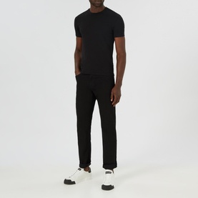Model wearing Boss Black Casual Maine Mid Rise Straight Leg Jeans in black, styled with a black crew-neck tee and white trainers