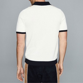 Model wearing Reiss Claude Stripe Zip Neck Polo Shirt in blue, rear view, with navy tipping on collar and cuffs