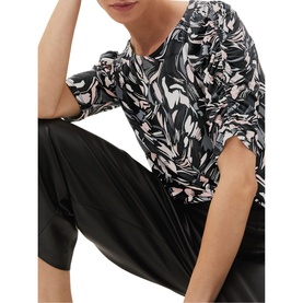 Model wearing Phase Eight Bryony Print Top in multi abstract floral print with ruched short sleeves, styled with black satin trousers