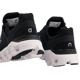 On Running Cloudswift Trainers in black with white CloudTec sole, shown from rear three-quarter angle as a pair