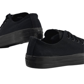 Converse All Star Low Tops in all-black canvas with black rubber sole, lace-up front, rear three-quarter view