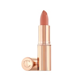 Charlotte Tilbury KISSING Lipstick in nude-pink shade, gold ribbed bullet casing with engraved CT logo on lid
