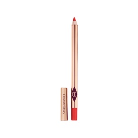 Charlotte Tilbury Lip Cheat lip liner pencil in coral-red with gold cap beside it, standing upright on white background.