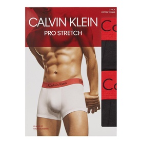 Calvin Klein 2 Pack Pro Stretch Cotton Trunks in black, one black and one white pair with red waistband, shown in packaging