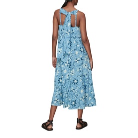 Model wearing Whistles Cecilia Batik Garland Dress in blue floral print, back view, styled with black flat sandals