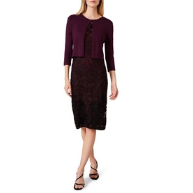 Model wearing Phase Eight Catie Cardigan in burgundy, styled with a matching lace midi dress and black heeled sandals