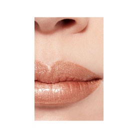 CHANEL Ultrawear Shine Liquid Lip Colour shown on lips in a warm nude peach shade with glossy finish