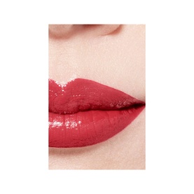 Close-up of lips wearing CHANEL Ultrawear Shine Liquid Lip Colour in a deep red shade with high-gloss finish