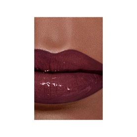 Chanel Ultra Wear Liquid Lip Colour in shade BEIGE CHIC 164 applied to lips, showing deep berry tone with glossy finish