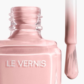 Chanel Le Vernis nail varnish, sheer pale pink shade, open bottle with brush applicator showing glossy formula