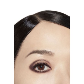Model with CHANEL Stylo Ombre Et Contour in Rouge Noir, deep burgundy-red smoky eye look shown in close-up eye detail shot