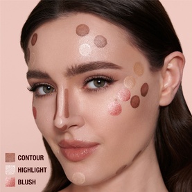Model with Charlotte Tilbury Beauty Lightwand contour, highlight and blush application dots mapped on face showing placement guide