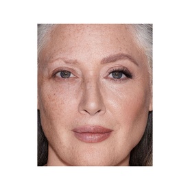 Model with Charlotte Tilbury Brow Cheat Brow Pencil in Taupe, shown on mature skin with defined brows and subtle makeup look