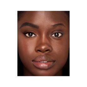 Model with Charlotte Tilbury Brow Cheat Brow Pencil in Natural Black, showcasing defined, fuller-looking brows with a polished makeup look