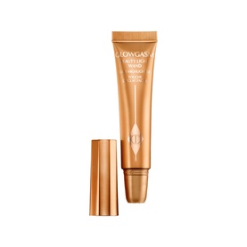 Charlotte Tilbury Beauty Light Wand Highlighter in Medium/Deep, gold tube with matching cap, liquid highlighter formula