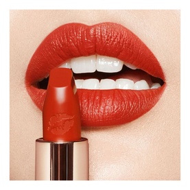 Charlotte Tilbury Hot Lips 2.0 Refill lipstick in Red Hot Susan, a warm red-orange shade, shown applied on lips with gold-toned bullet casing