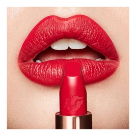 Charlotte Tilbury Hot Lips 2.0 Refill lipstick in Patsy Red, a vivid true red, shown applied on lips with bullet detail visible