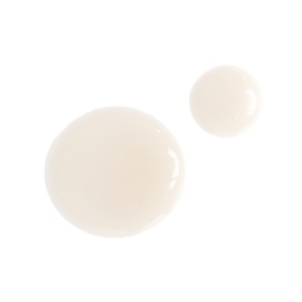 Charlotte Tilbury Magic Serum Crystal Elixir texture swatch showing two drops of lightweight, milky-white serum formula on white background