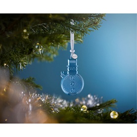 Waterford Christmas Snowman Ornament Topaz Ice, clear crystal snowman decoration hanging from a Christmas tree branch