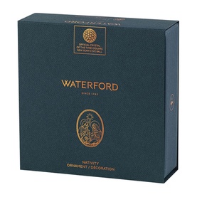 Waterford Nativity Ornament gift box in dark teal with gold foil branding and oval Nativity illustration detail
