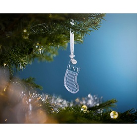 Waterford Christmas Stocking Ornament in clear crystal, hanging from a decorated Christmas tree with ribbon