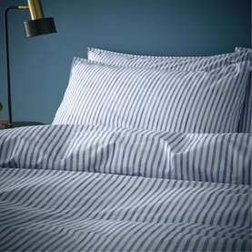 Content by Conran Chelsea Duvet Set Navy, navy and white stripe cotton bedding styled on a bed with matching pillowcases