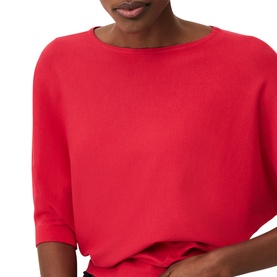 Model wearing Phase Eight Cristine Batwing Knit Sweater in pink, cropped view showing batwing sleeves and round neckline