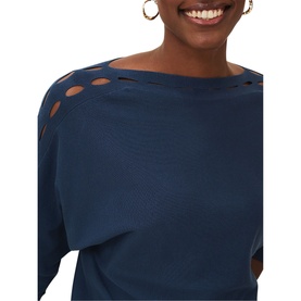 Model wearing Phase Eight Cristine Slash Knit in blue, featuring cut-out slash detail at shoulder and neckline, paired with gold hoop earrings