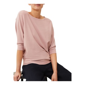 Model wearing Phase Eight Cristine Fine Knit Sweater in pink, with draped twist front detail and three-quarter sleeves, styled with navy trousers