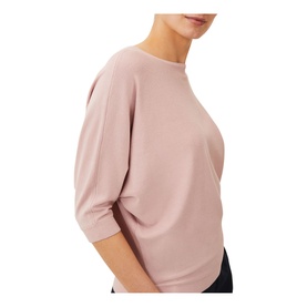 Model wearing Phase Eight Cristine Fine Knit Sweater in pink, featuring a mock neck and relaxed three-quarter length sleeves