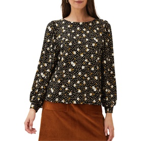 Model wearing Phase Eight Daizy Ditsy Print Jersey Top in black multi floral print with blouson sleeves, styled with a tan skirt