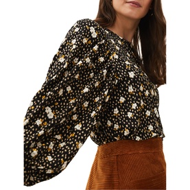 Model wearing Phase Eight Daizy Ditsy Print Jersey Top in black multi floral, blouson sleeves with cuffs, styled with tan corduroy skirt